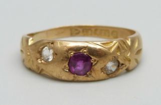 A 15ct gold ring set with a ruby and two white stones (one replaced), 3.2g, O