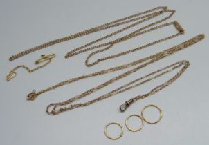 A 9ct gold curb chain necklace, a fine yellow metal figaro link guard chain, a yellow metal safety