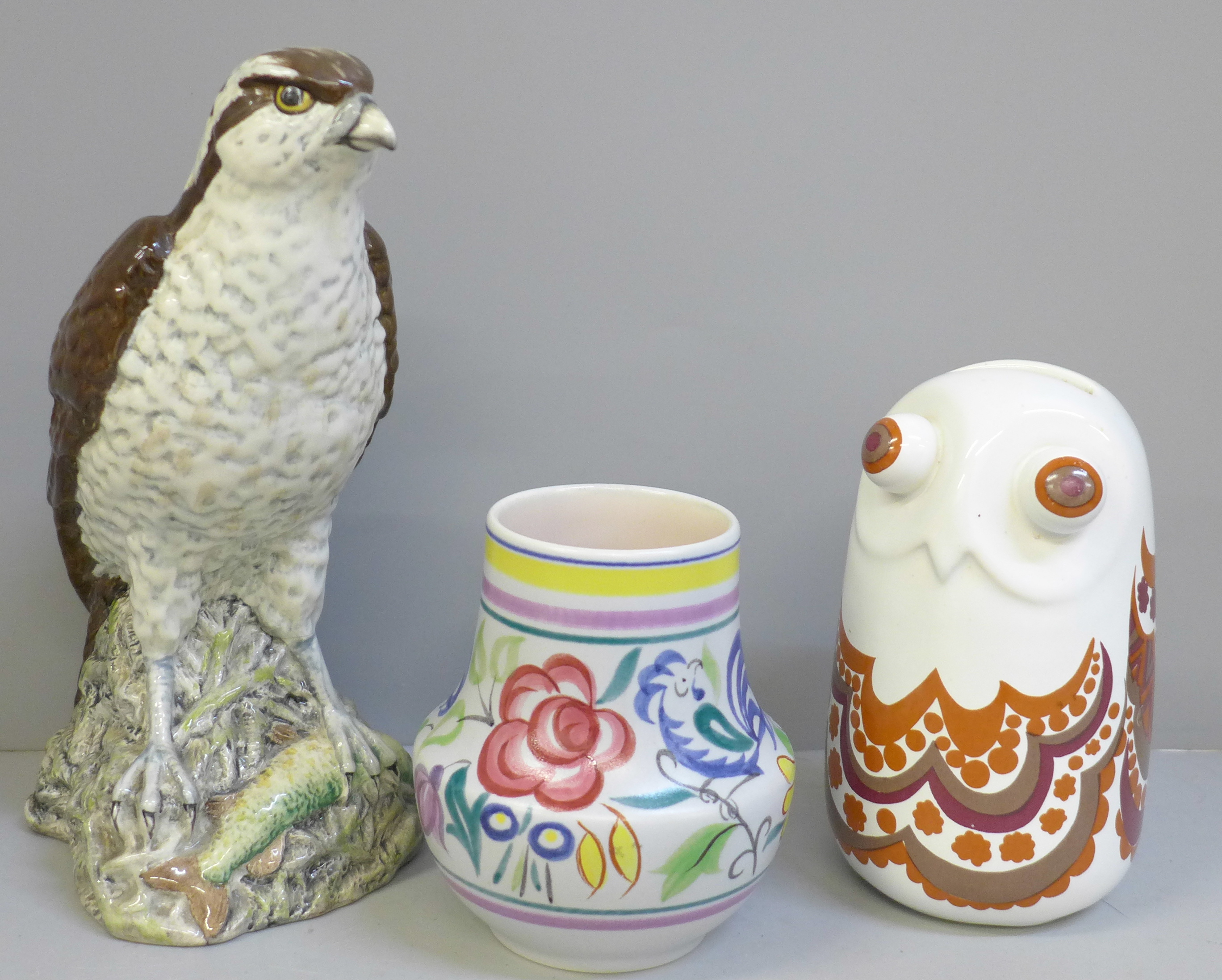 A Carlton Ware owl money box, a Poole vase and a Beswick Osprey whisky flask
