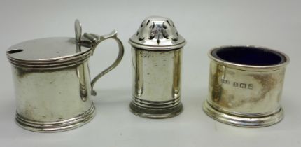 A Victorian silver mustard and pepper, London 1885/6, and a silver salt, 111g