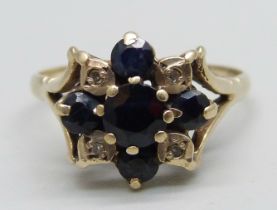 A 9ct gold, sapphire and diamond ring, one sapphire loose in setting (claw a/f), 2.9g, R