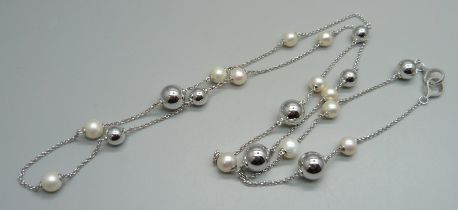 A Georg Jensen silver and cultured pearl guard chain, 39g, approximately 97cm