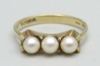A 9ct gold ring set with three pearls, 2.2g, N