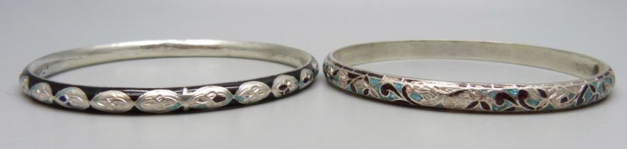 Two white metal and enamelled bangles, enamel a/f, tests as silver, 27g