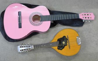A Martin Smith pink guitar and a vintage mandolin