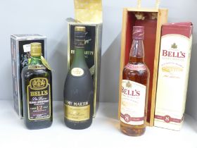 A bottle of Remy Martin Cognac Fine Champagne VSOP, boxed and two boxed bottles of Bell's Whisky, 12
