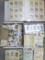 Cigarette cards; a box of cigarette and trade cards, loose and in albums