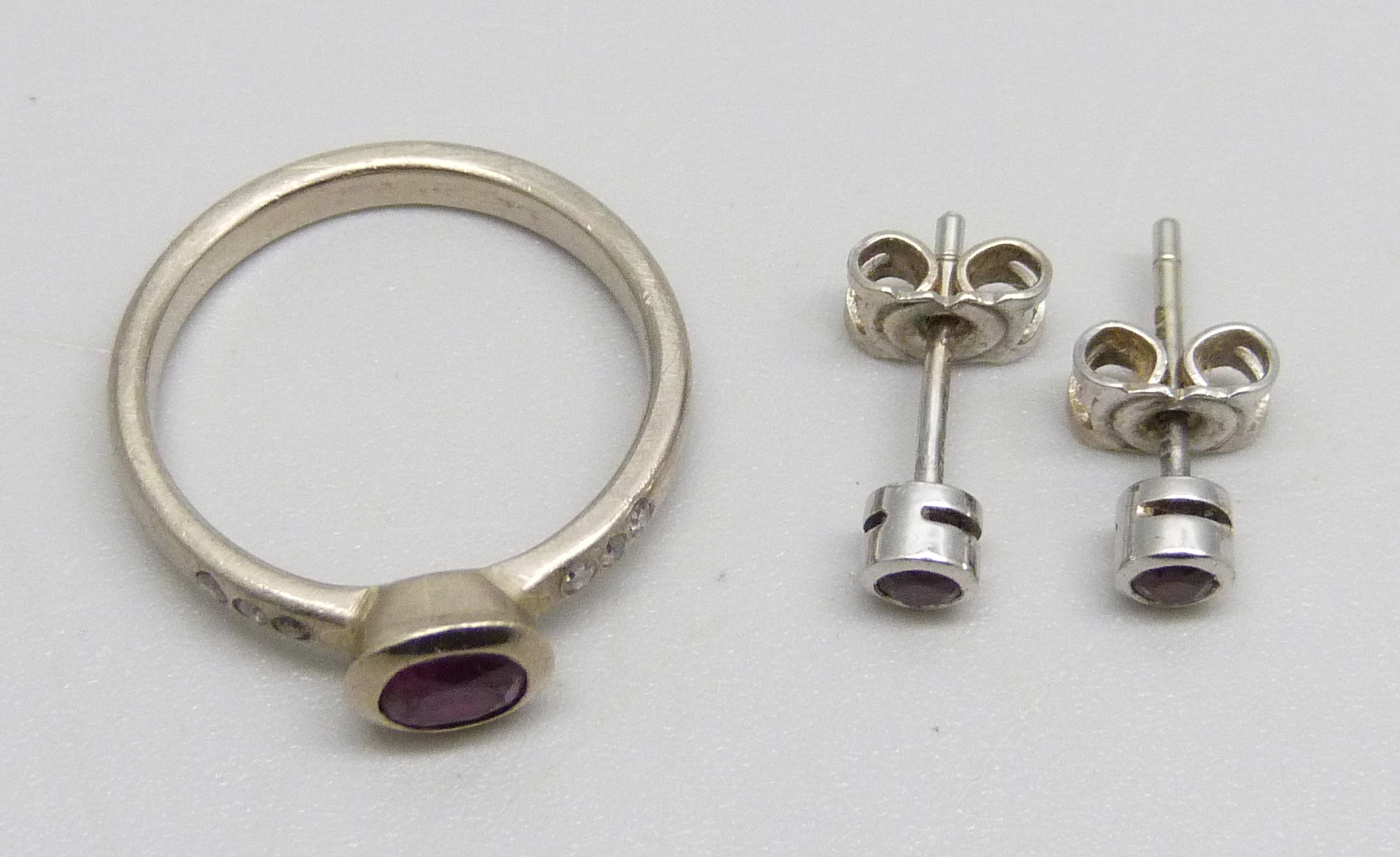 A 14ct white gold, diamond and ruby ring, M, and a pair of 18ct white gold and ruby stud earrings, - Image 2 of 2