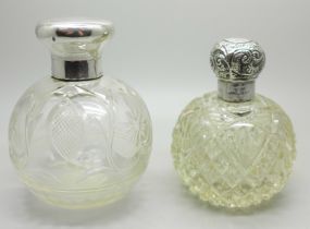 Two silver topped glass scent bottles, one by William Comyns