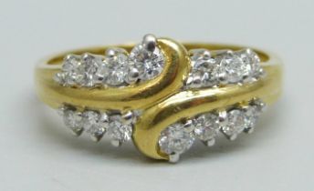 An 18ct gold ring set with 14 diamonds, 4.4g, P/Q