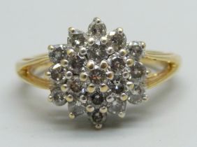 An 18ct gold and diamond cluster ring, one carat weight, 4.8g, N