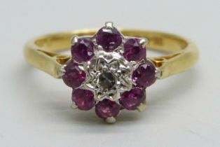 An 18ct gold, diamond and ruby cluster ring, 3.4g, M