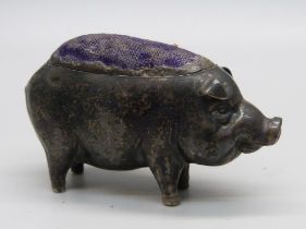 A silver pin cushion in the form of a pig, Birmingham, 1906, 35g, 5.5cm long