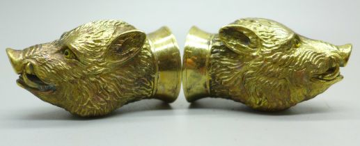 A pair of well modelled gold plated boar's head salt and pepper condiments, marked '18ct gold plate'