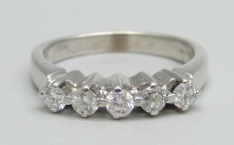 An 18ct white gold ring set with five diamonds, 5g, O