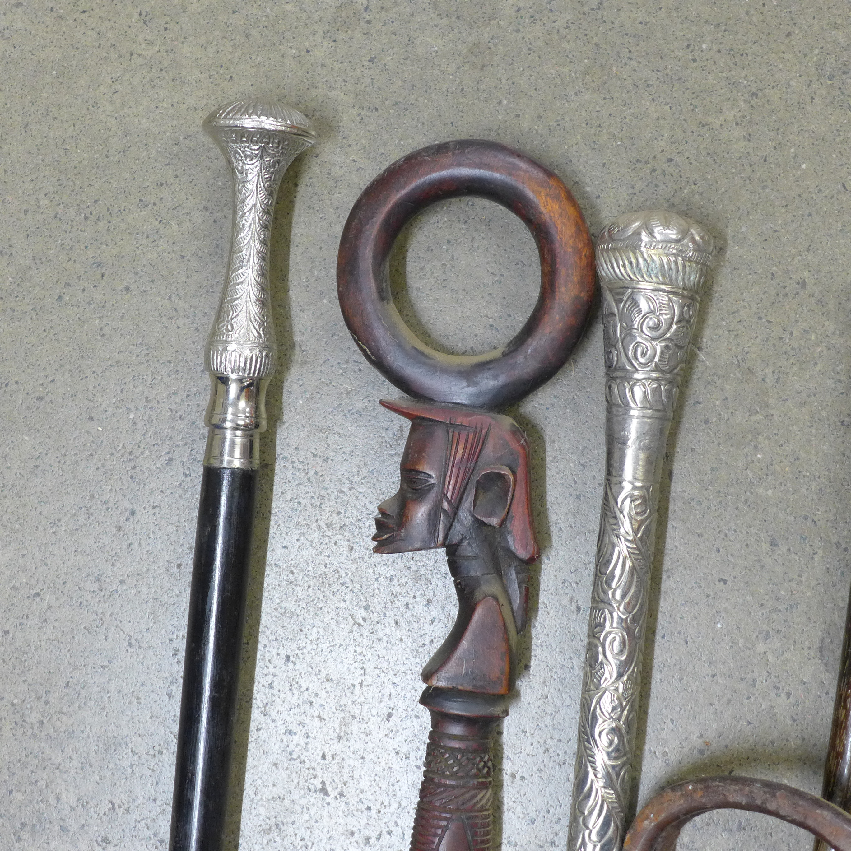 A collection of seven walking sticks including one with silver top and a shooting stick **PLEASE - Image 3 of 8