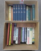 A collection of books including The Handbook of British Birds, other bird books, Alice in