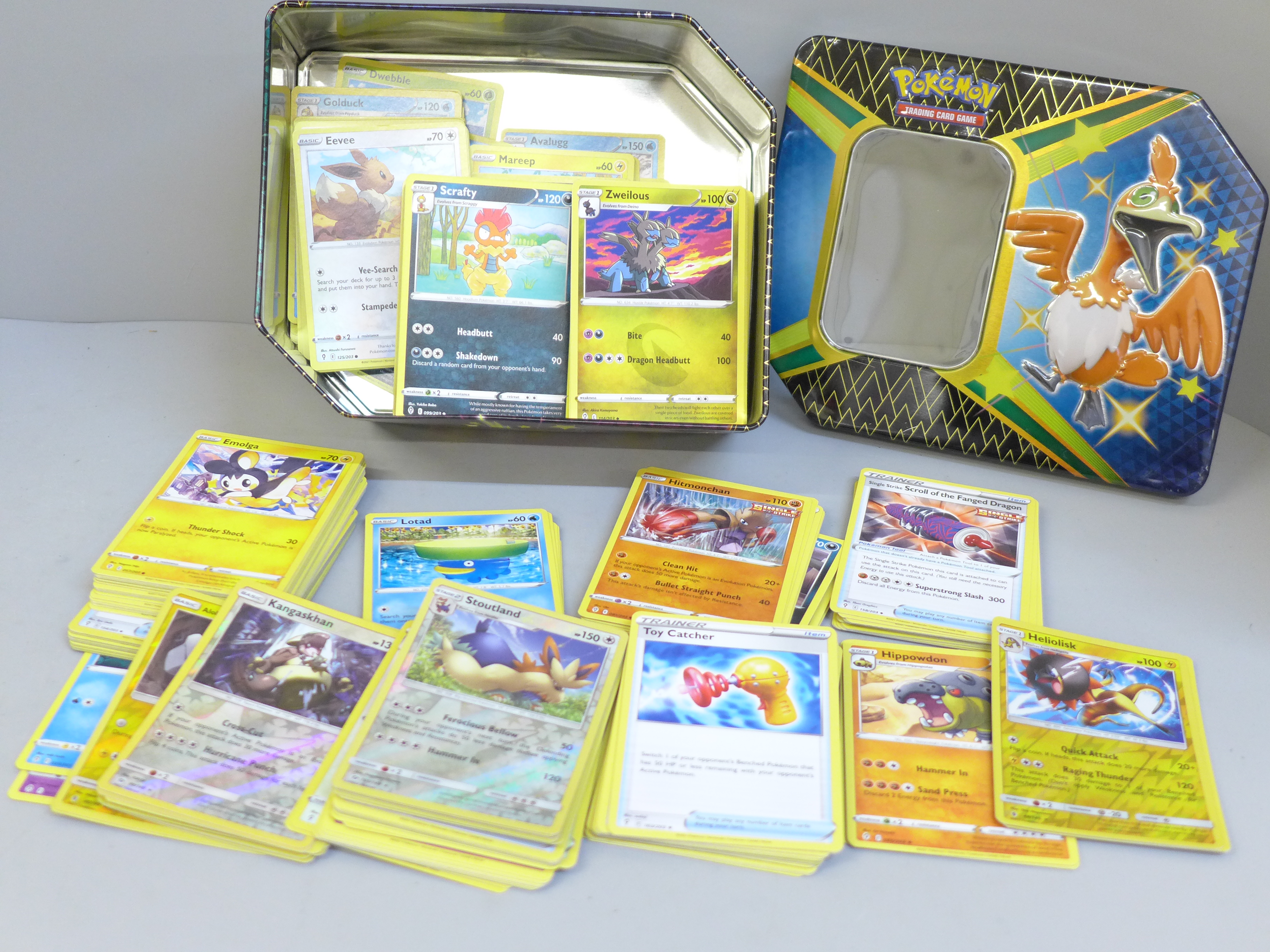 A tin of approximately 300 Pokemon cards