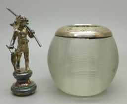A silver rimmed glass match striker and a small silver winged cherub figure