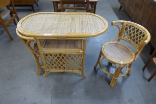 A bamboo and wicker table and two chairs