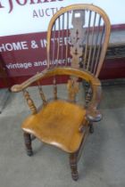 A 19th Century elm and yew wood highback Windsor chair