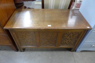 A 17th Century style carved oak blanket box