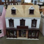 A painted doll's house and accessories