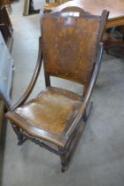 A 19th Century American beech rocking chair