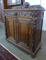 A 19th Century French carved oak two door cupboard