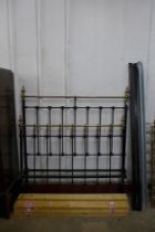 A Victorian brass and wrought iron double bed