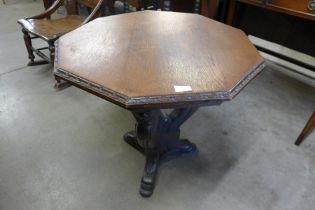 A 19th Century Italian Baroque Revival carved oak octagonal centre table