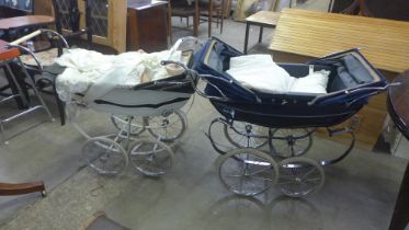 Two vintage prams, one containing linen and a porcelain doll