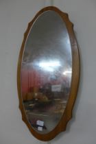 A teak framed mirror