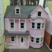 A painted doll's house with accessories