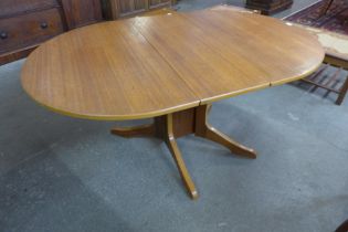 A teak drop-leaf table