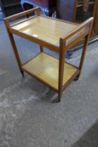 A teak and simulated rosewood cocktail trolley