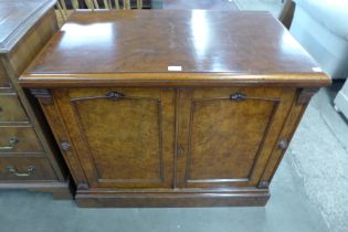 A Victorian figured walnut two door cupboard