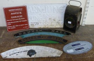 A railway lamp and assorted railway plaques