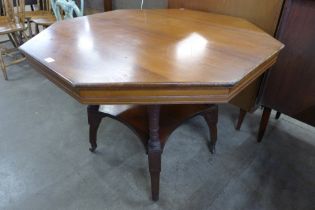 A Victorian Aesthetic Movement walnut octagonal centre table