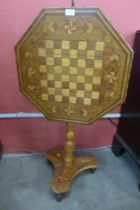 A 19th Century Italian inlaid walnut octagonal tilt-top games table