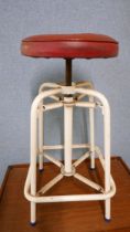 An industrial sprung metal stool