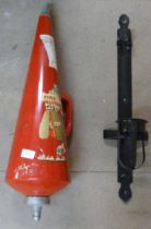 A Mini Max Type A 1970s water fire extinguisher and an earlier bracket for a fire extinguisher