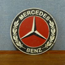 A cast Mercedes Benz plaque