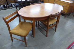 A Jentique teak oval extending table and four chairs