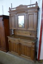 A 19th Century French Henry II style oak side cabinet