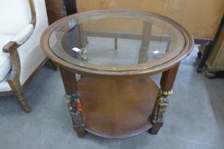 A French oak and glass topped circular two tier coffee table