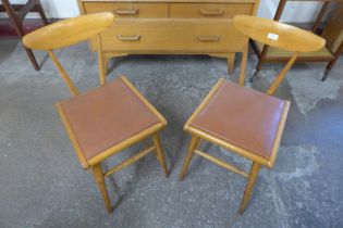 A pair of beech kitchen chairs