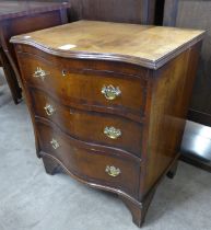 A George III style mahogany serpentine bachelor's chest of drawers