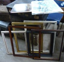 A collection of assorted picture frames and four prints