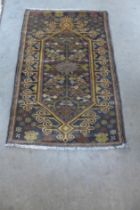 A Pakastani blue ground prayer rug, 119 x 92cms